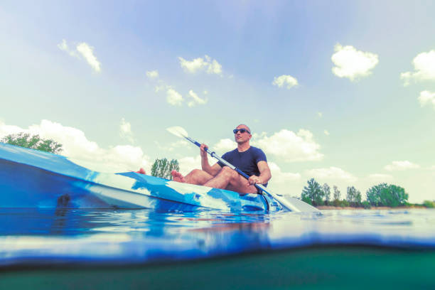 istock Young Man Kayaking on Lake, Kayaking Underwater View, Split Shot. 1191098114