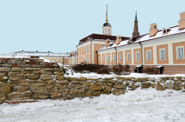 The building of the Kazan Kremlin and part of the old stone ruins. Winter season stock photo