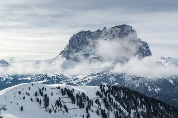 Cloudy view of Dolomites near Colfosco of Val di Fassa, Trentino-Alto-Adige region, Italy.