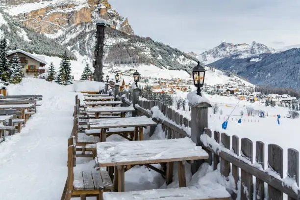 Cloudy view of outdoor cafe at Dolomites near Canazei of Val di Fassa, Trentino-Alto-Adige region, Italy.