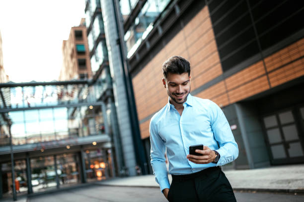 istock Millennial businessman using mobile app on smart phone 1191104704