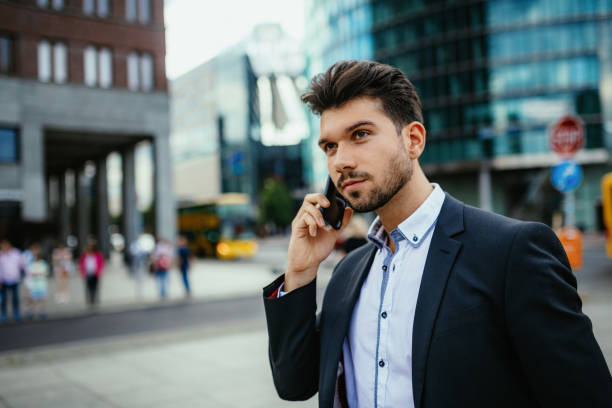 istock Millennial businessman using mobile phone for business talk 1191106315