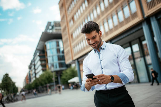 istock Millennial businessman using mobile app on smart phone 1191106319