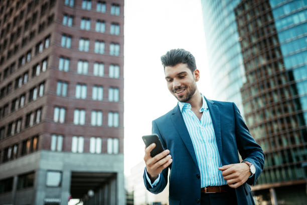 istock Millennial businessman using mobile phone for emailing and electronic banking 1191109539