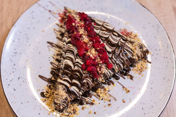 istock Delicious crepes with chocolate spread 1191111447