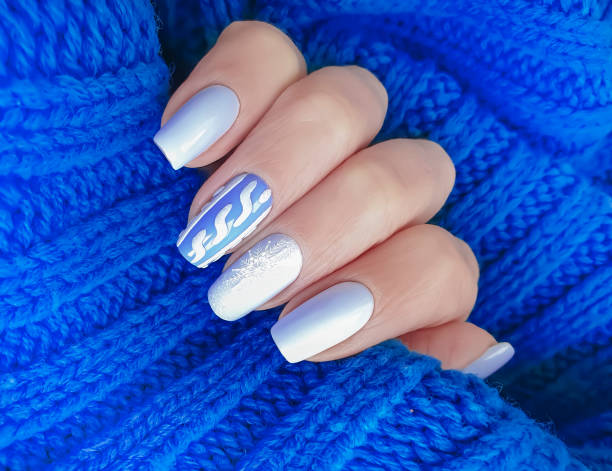 istock female hand beautiful manicure sweater 1191112153