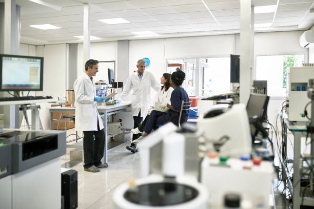 istock Pathology Lab Coworkers Gathered for Informal Meeting 1191114002