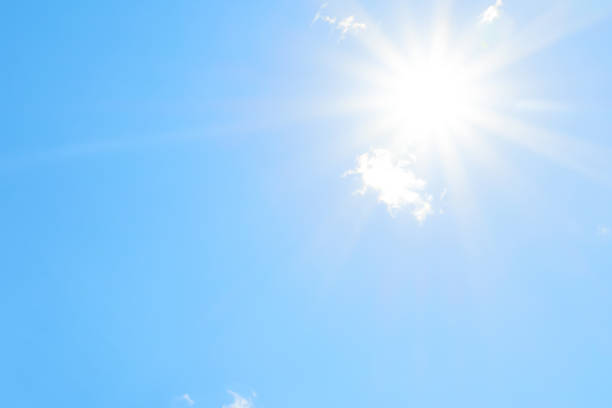 istock Bright sun with beautiful beams in the sky with clouds 1191121589