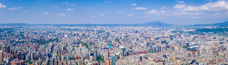 Aerial panorama over the highrise housing, skyscrapers and crowded cityscape of central Taipei, Taiwan’s vibrant capital city.