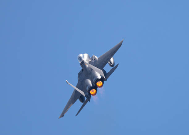 F-15 Eagle in a very close rear view, with afterburners on, in beautiful light
