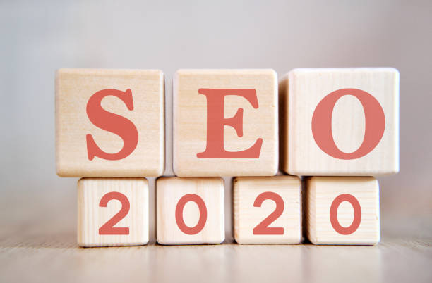 istock Seo 2020 concept. Wooden cubes on a black keyboard 1191126274