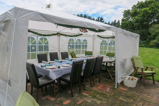 Getting ready for a family Christmas lunch on the lawn under a gazebo as protection from the summer heat