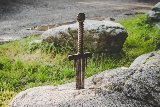 excalibur the famous sword in stone of king Arthur. legend of king Arthur excalibur the famous sword in the stone of king Arthur. legend of king Arthur arthurian legend stock pictures, royalty-free photos & images