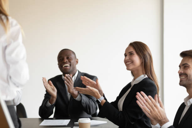 istock Mixed race happy employees workers applauding to speaker. 1191132042