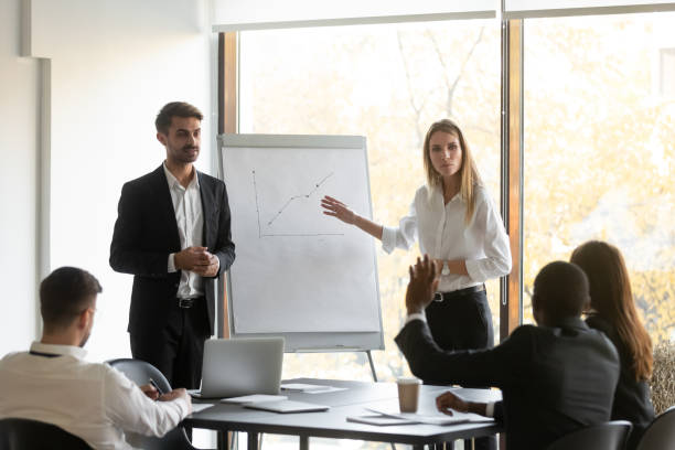 istock Two young speakers trainers holding educational seminar. 1191132045