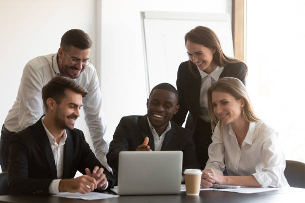 istock Positive african american male employee showing computer software. 1191132577