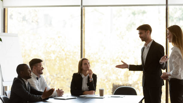 istock Confident millennial manager introducing new female worker. 1191132588