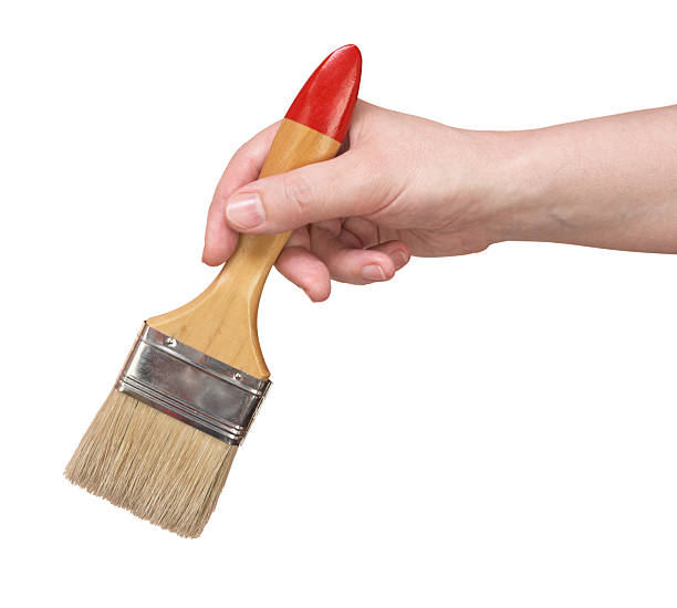 woman's hand with the paintbrushes stock photo