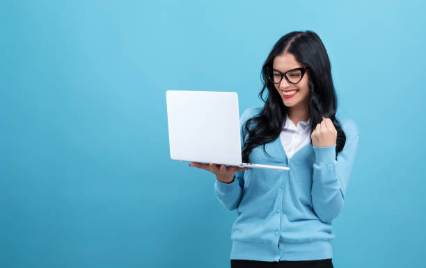 istock Young woman with a laptop computer 1191152672