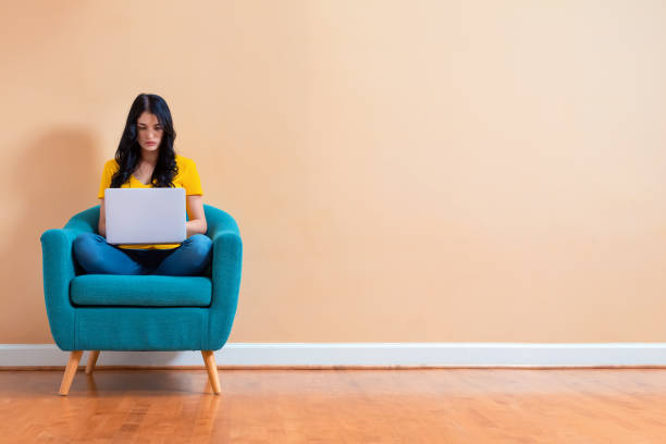 istock Young woman with a laptop computer 1191152716