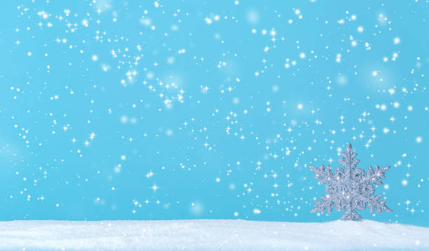 istock Snowflake in a snow covered landscape 1191152885