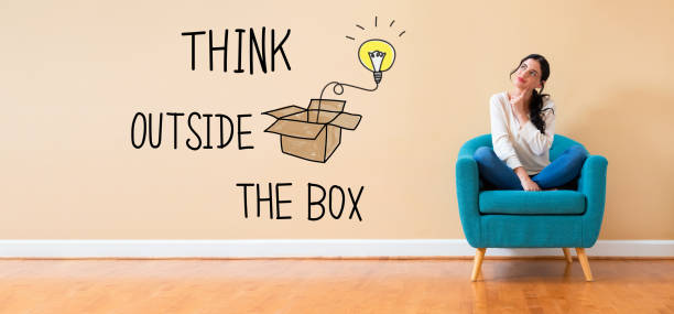 istock Think outside the box with woman in a thoughtful pose 1191154682