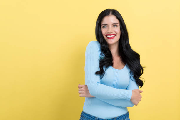istock Young woman with crossed arms 1191154686