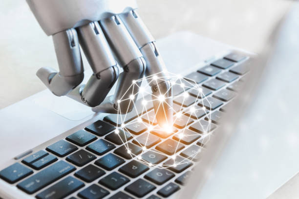 istock Robot hands and fingers point to technology laptop button advisor chatbot robotic artificial intelligence concept 1191155360