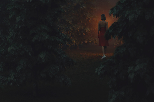 Woman walking in mysterious forest at night. This is entirely 3D generated image.