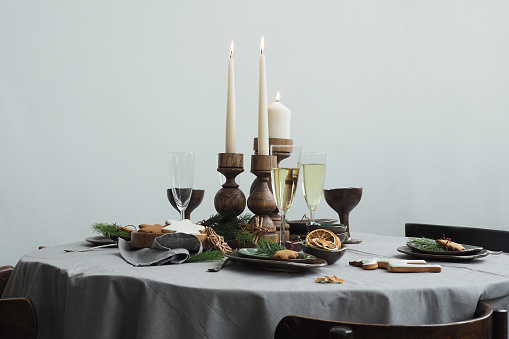 Round served table with festive vintage table setting.