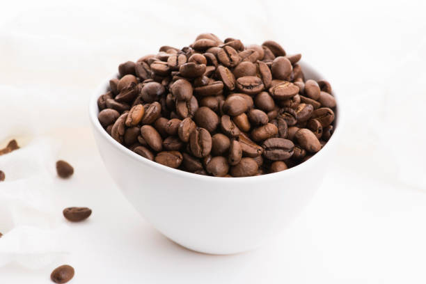 istock Bowl of caffee beans on a white background 1191161518