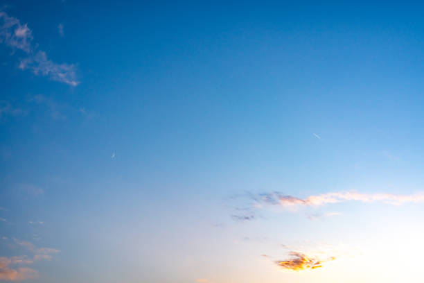Evening sky with white clouds. Evening sky with copy space. Evening sky with white clouds. Evening sky with copy space. contrail moon on a night sky stock pictures, royalty-free photos & images