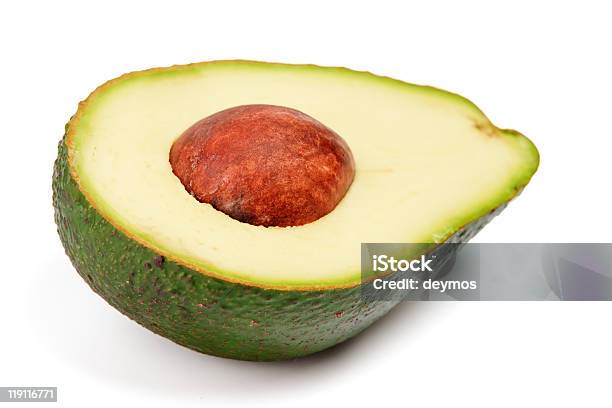 Die Hälfte Avocado Mit Feuerstelle Isoliert Auf Weißem Hintergrund Stockfoto und mehr Bilder von Avocado