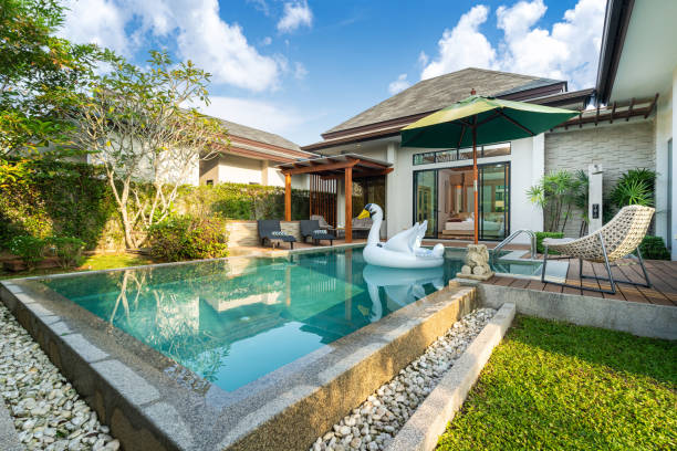 istock Swimming pool in tropical garden pool villa feature floating balloon 1191167791