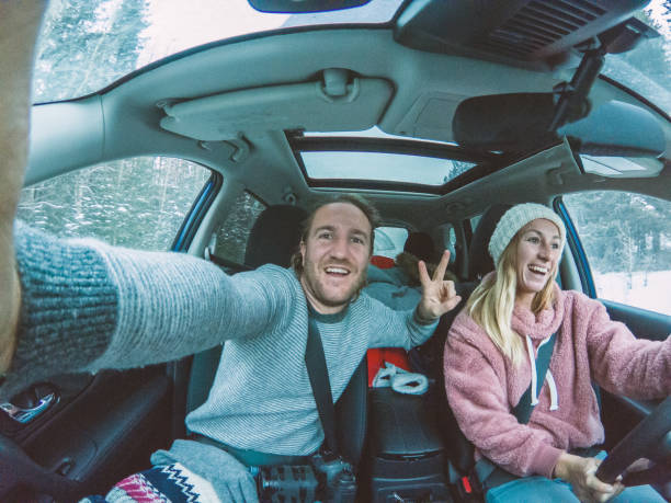 istock Couple taking selfie on winter road trip 1191175163
