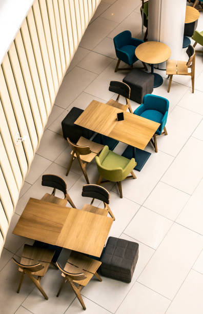 tables and chairs in cafe. ontemporary design of bar furnishings. coffee shop in a shopping center. - 16705 imagens e fotografias de stock