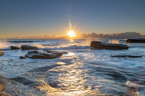 istock Rocks and Sun Star Seascape 1191178307