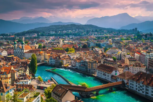 Photo of Wonderful Lucerne cityscape with Reuss river and Chapel bridge, Switzerland