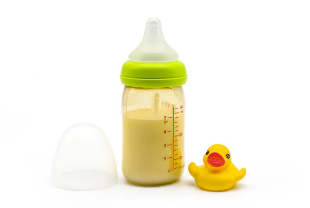 Shot of a young mother bottle-feeding her baby boy