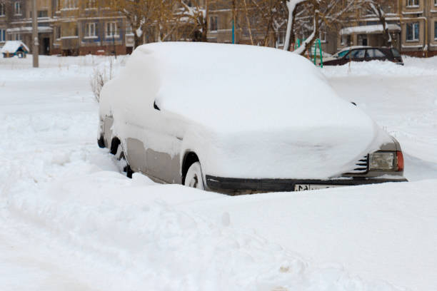 istock The car is covered with a thick layer of snow 1191185823
