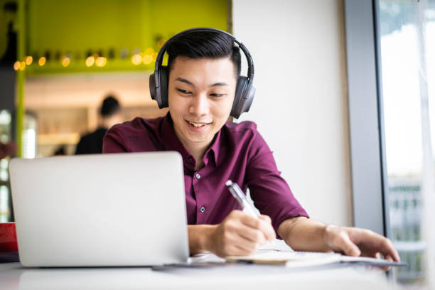 istock Asian millennial working in cafe. 1191187627