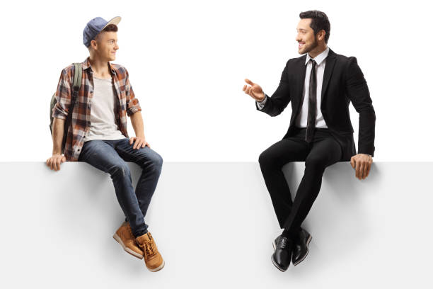 istock Businessman talking to a male student and sitting on a panel 1191188152