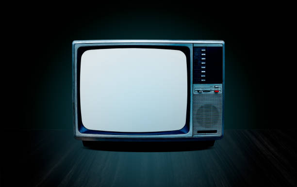 istock vintage old television receiver on table front gradient green wall background,vintage tv with cut screen on perspective wooden floor,blue glow and dark tone style 1191188445