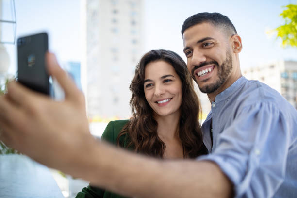 istock Couple taking selfie with a smart phone 1191193105