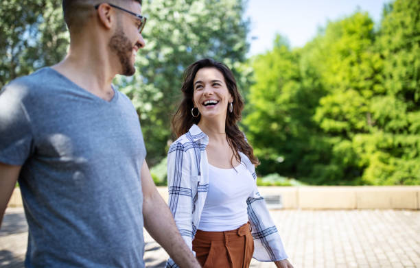 istock Smiling couple enjoying a walk in the park 1191193109