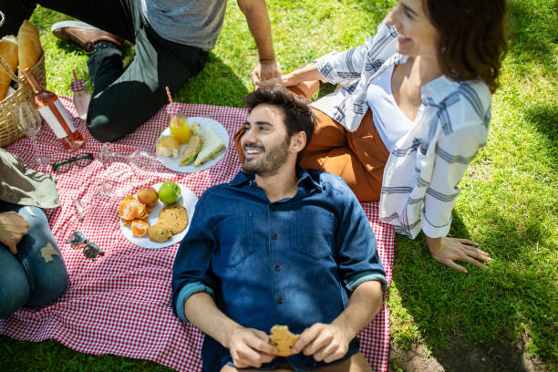istock Friends having picnic in park 1191193119