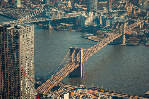 Aerial view of Brooklyn Bridge with heavy traffic during rush hour over the East River in New York City