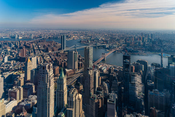 Aerial view of Lower Manhattan, Brooklyn Bridge and Manhattan Bridge in New York Aerial view of Lower East Side, downtown, Brooklyn Bridge and Manhattan Bridge, New York City. east river new york city photos stock pictures, royalty-free photos & images