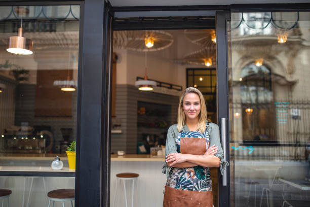 istock Confident Young Argentine Cafe Owner Standing at Front Door 1191194138