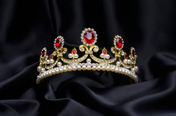 golden crown with rubies and pearls on a black silk golden crown with rubies and pearls on a black silk prom photos stock pictures, royalty-free photos & images